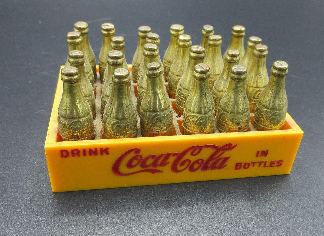Most unusual Coca Cola Miniature case of gold coke: Most unusual Coca Cola Miniature case of gold coke bottles. IN GOOD ORIGINAL AS FOUND CONDITION. Beautiful colors with Great quality and detail. Case measures 3 ½ by 2 3/8 inches.