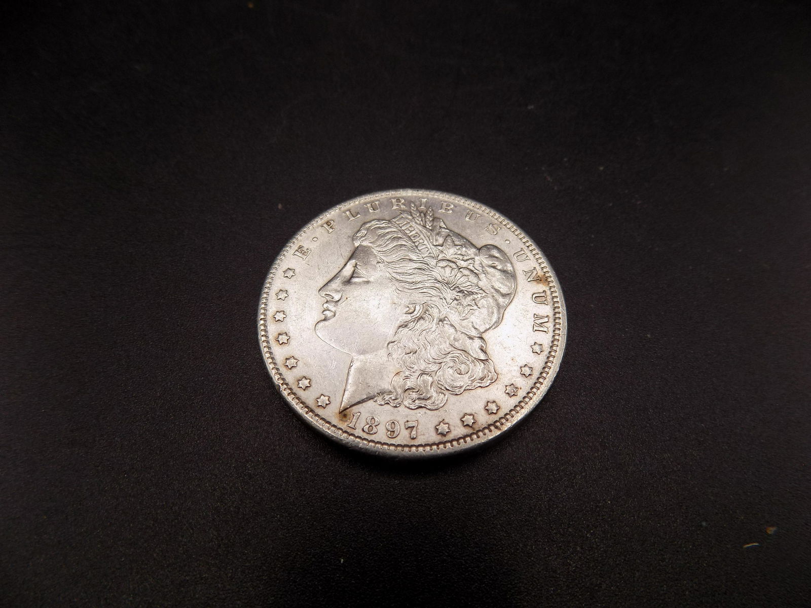 Uncirculated 1897 Morgan silver dollar (1 of 2)