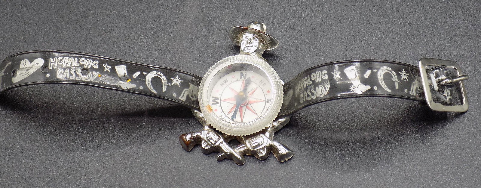 Vintage Hopalong Cassidy compass with fancy wristband: Vintage Hopalong Cassidy compass with fancy wristband. Compass works. In good original as found condition. Beautiful colors. Great quality and detail. Band measures 7 ½” long