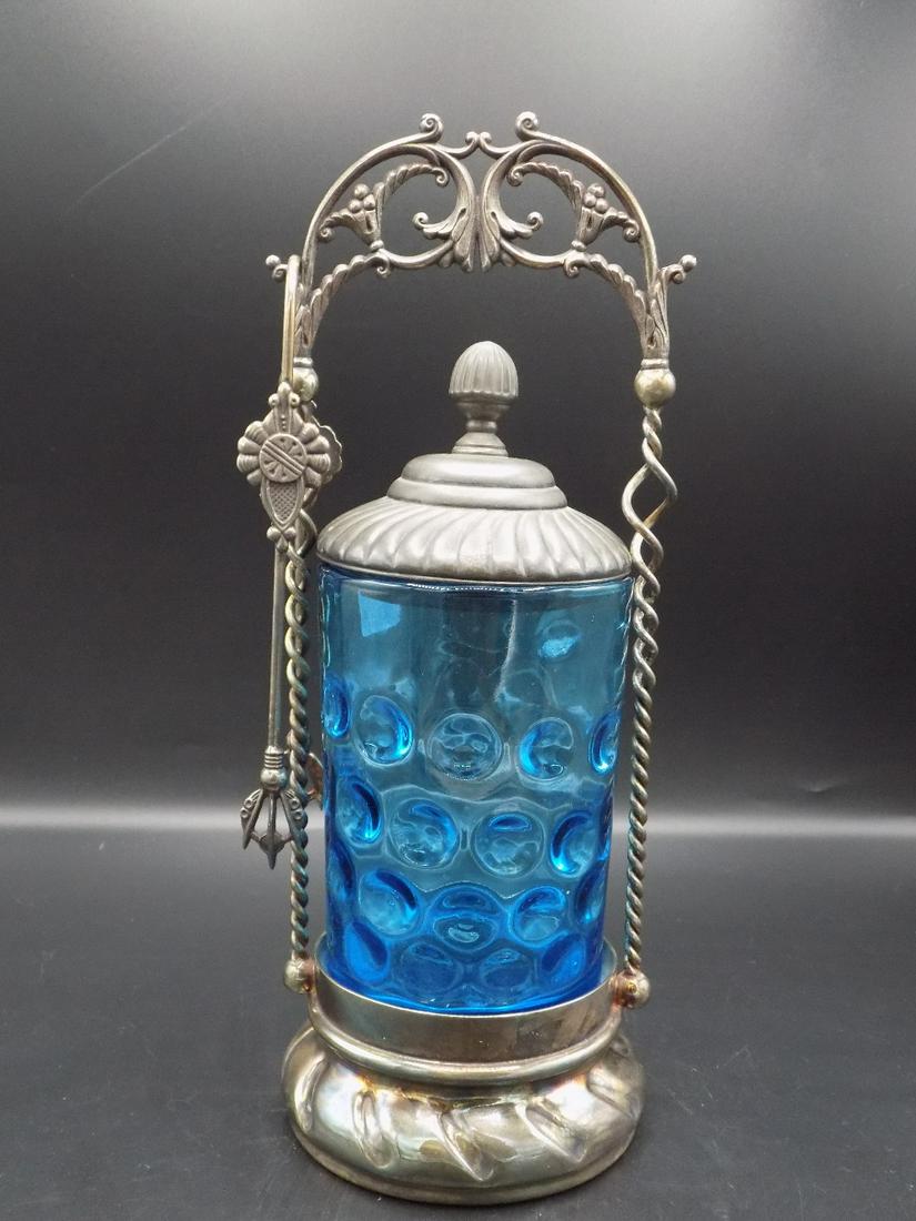 Lovely Victorian blue art glass pickle castor.: Lovely Victorian blue art glass pickle castor. Thumbprint decoration. Marked Pairpoint on base. In good original as found condition. Beautiful colors. Great color and detail. Measures 10 ¾” x 3 ½�