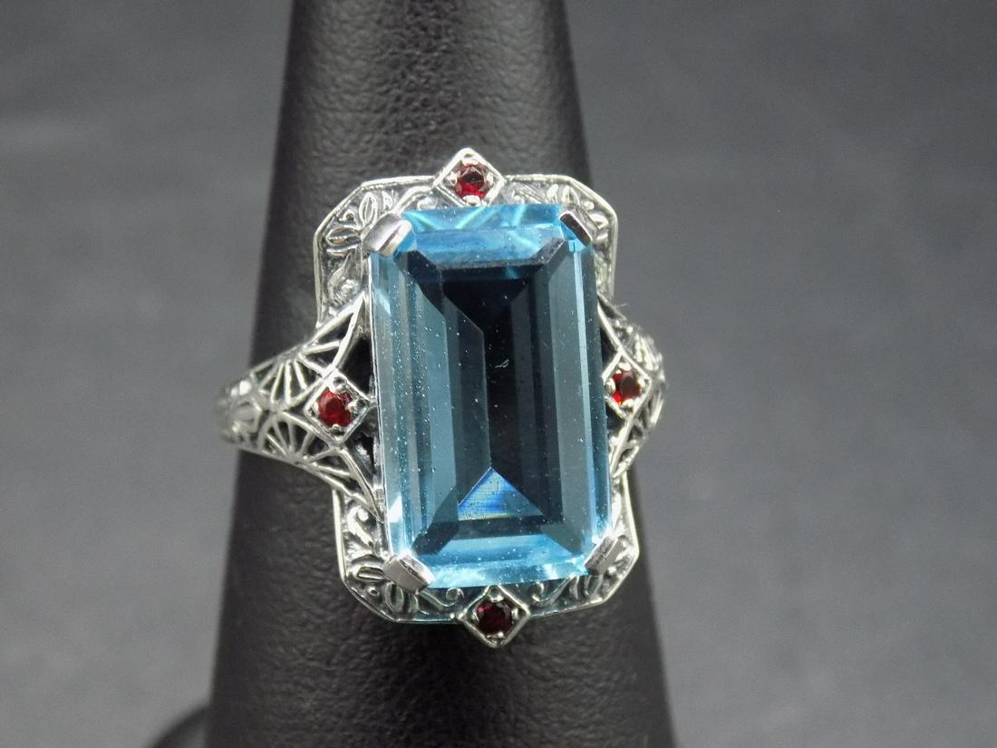 Beautiful approx. 12 cwt. Aquamarine and ruby .925: Beautiful approx. 12 cwt. Aquamarine and ruby .925 sterling silver ring. Heat treated aquamarine. Size 9. Beautiful colors and design. In good original as found condition