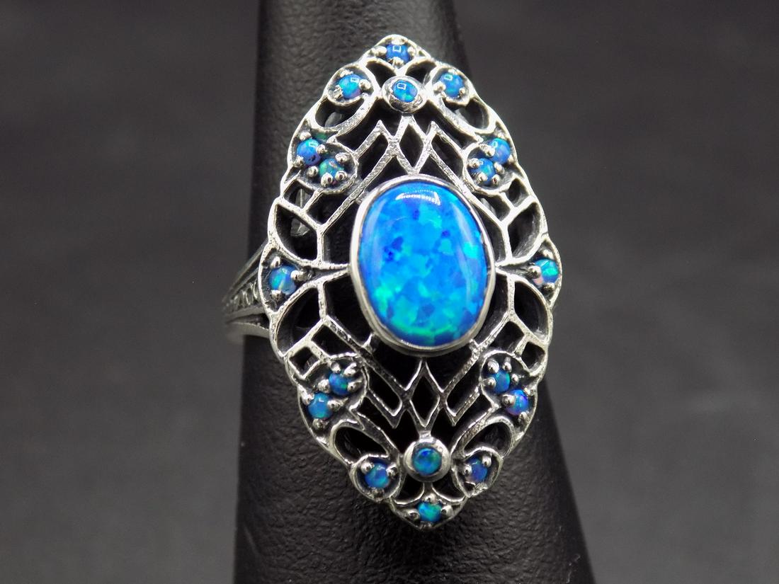 Beautiful 2 ct. blue opal .925 Sterling silver filigree: Beautiful 2 ct. blue opal .925 Sterling silver filigree ring. Beautiful colors. Size 5 ½.