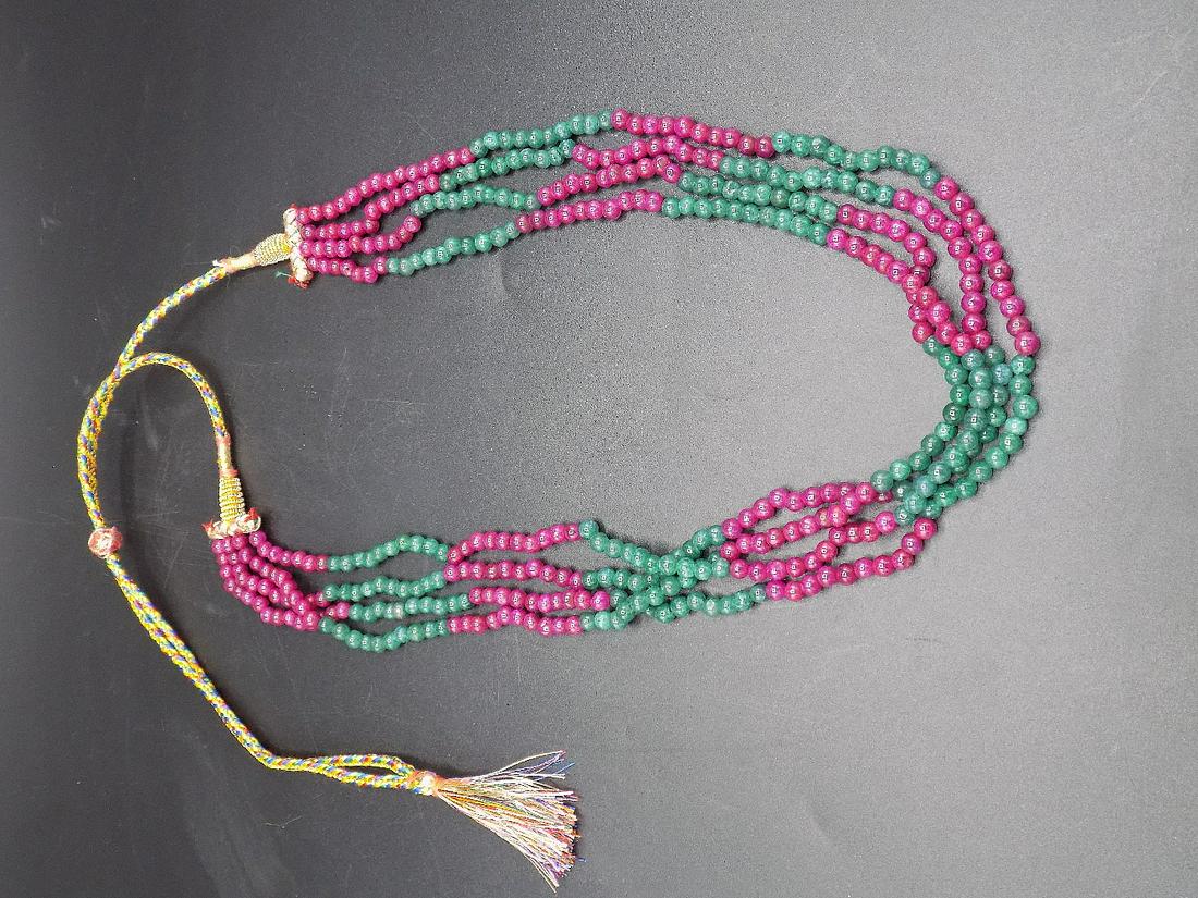 342 cwt. Genuine red ruby and emerald beaded necklace: Four strand 342 cwt. Genuine red ruby and emerald beaded necklace. In good original as found condition. Beautiful colors. Beaded part of necklace measures approximately 18