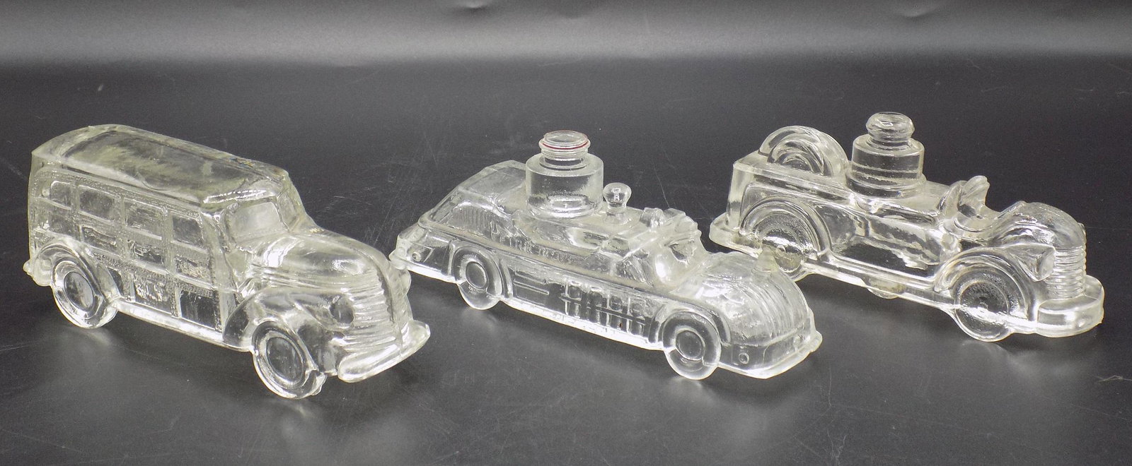 Three vintage glass candy containers: Three vintage glass candy containers. In good original as found condition. Longest measures 5 1/8” long