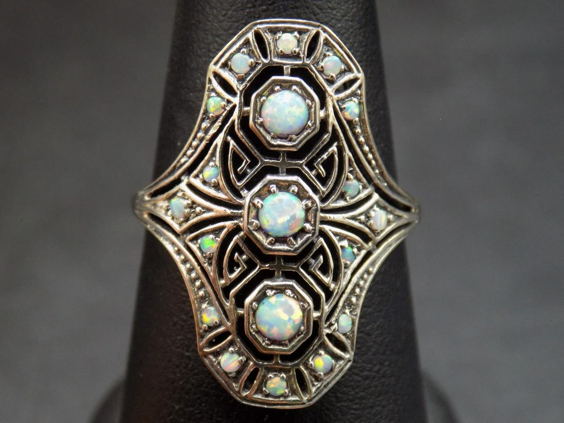 Beautiful fire opals in filigree .925 sterling silver: Beautiful fire opals in filigree .925 sterling silver ring. In very good original as found condition. Beautiful colors size 8