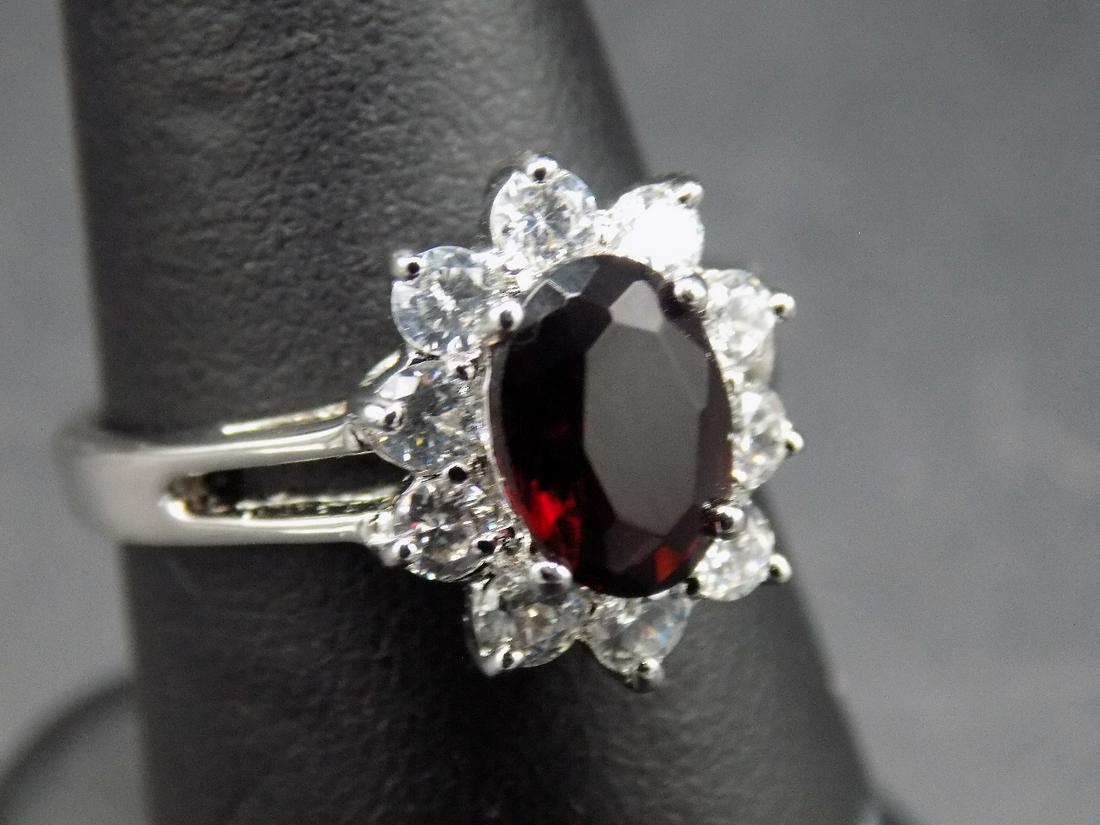 Beautiful approx. 4.80cwt. garnet and CZ sterling: Beautiful approx. 4.80cwt. garnet and CZ .925 sterling silver ring. In very good original as found condition. Beautiful colors. Size 9