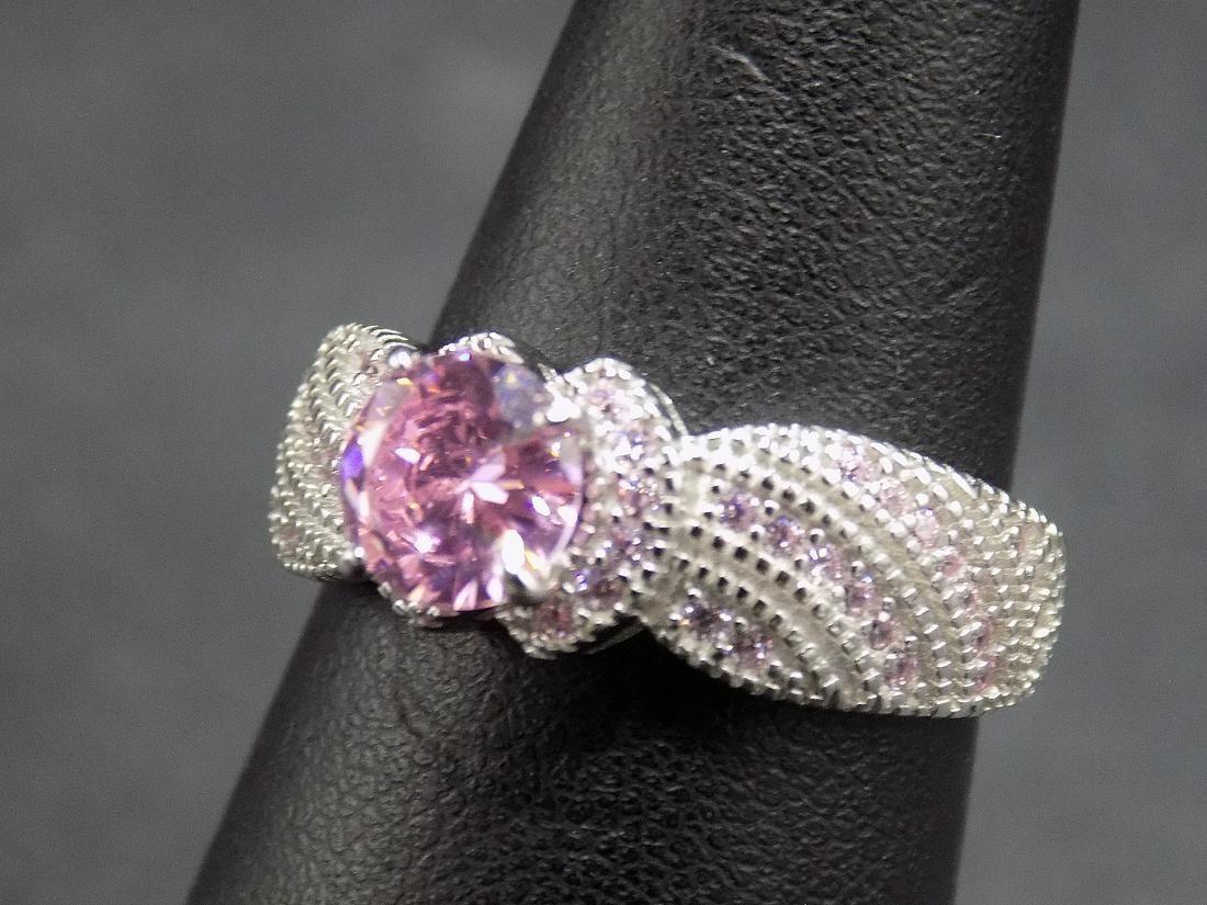 Beautiful approx. 3 cwt. pink sapphires sterling: Beautiful approx. 3 cwt. pink sapphires .925 sterling silver ring. Lab created. In good original as found condition. Beautiful colors. Size 8