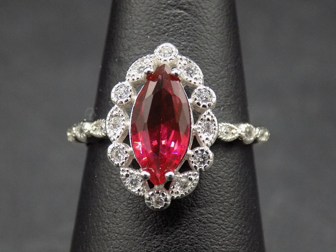Beautiful 3 cwt. Ruby and white topaz .925 sterling: Beautiful approx. 3 cwt. ruby and white topaz .925 sterling silver ring. Lab created. In very good original as found condition. Beautiful colors. Size 6 3/4