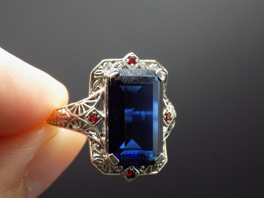 Beautiful 12 cwt. sapphires and ruby .925 sterling: Beautiful approx. 12 cwt. sapphires and ruby .925 sterling silver ring. Lab created. In good original as found condition. Beautiful colors. Size 9