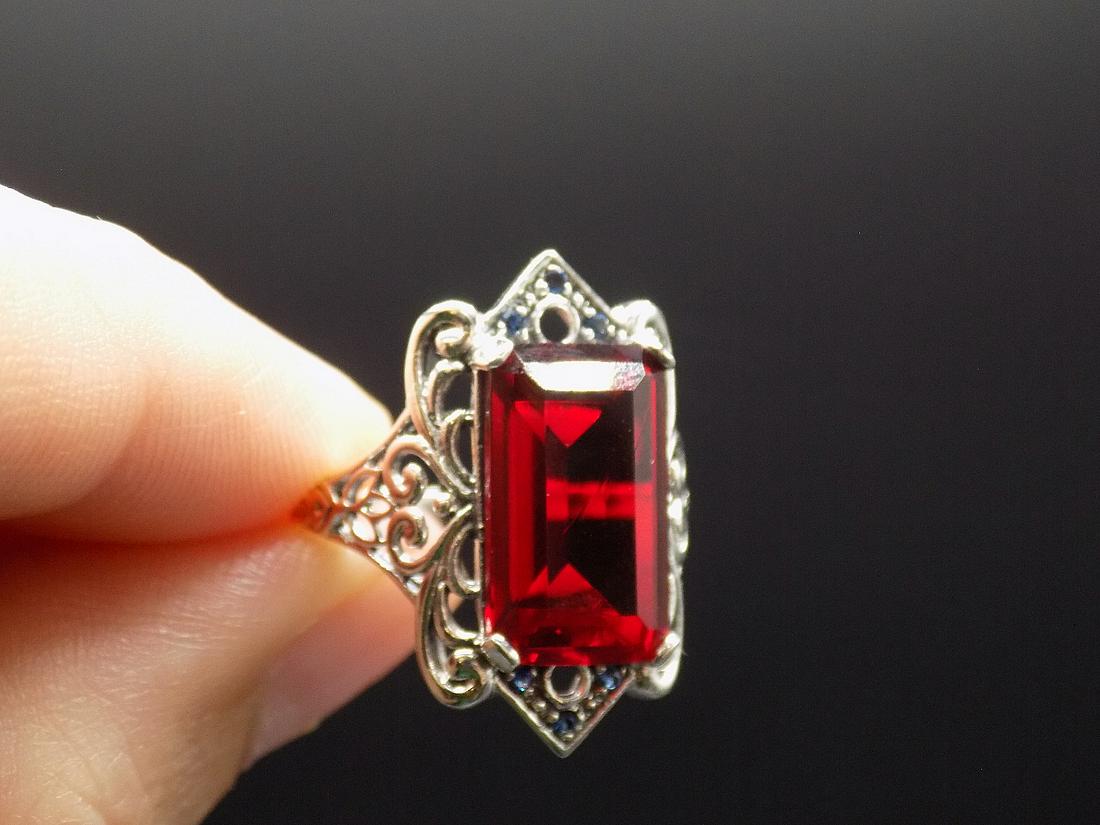 Beautiful 12 cwt. ruby and sapphire .925 sterling: Beautiful approx. 12 cwt. ruby and sapphire .925 sterling silver ring. Lab created. In good original as found condition. Beautiful colors. Size 7