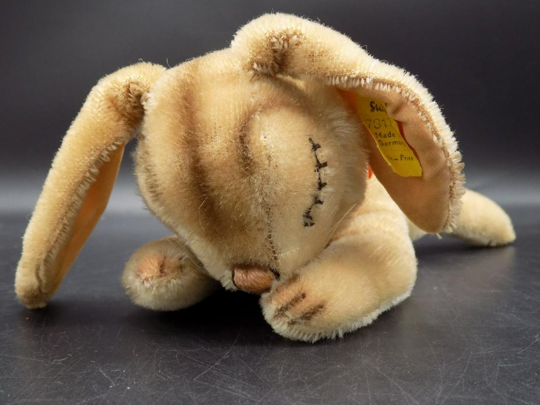 Cuddly Steiff sleeping bunny. Original tags.: Cuddly Steiff sleeping bunny. Original tags. In ear. In very good original as found condition. Beautiful colors. Great quality and detail. Measures approx. 8 ½” long