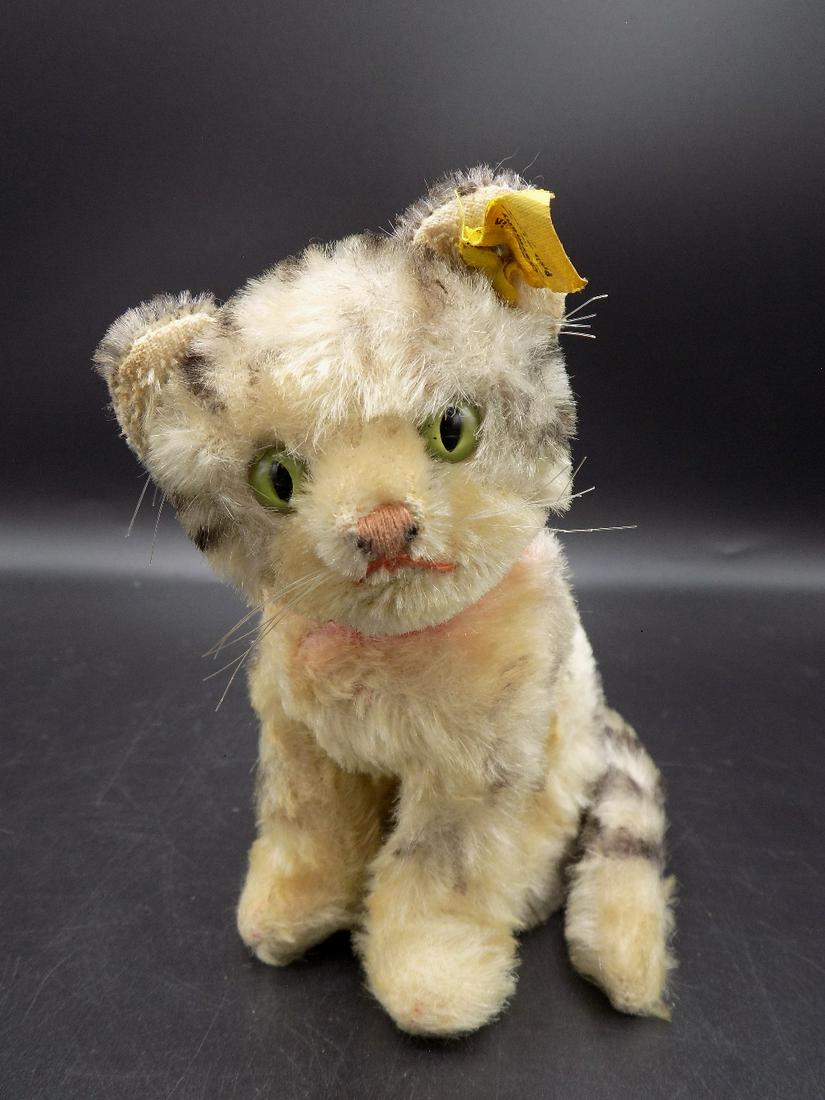 Cuddly Steiff kitten. Original tags in ear: Cuddly Steiff kitten. Original tags in ear. Head swivels. In very good original as found condition. Beautiful colors. Great quality and detail. Measures approx. 5 ½” tall.