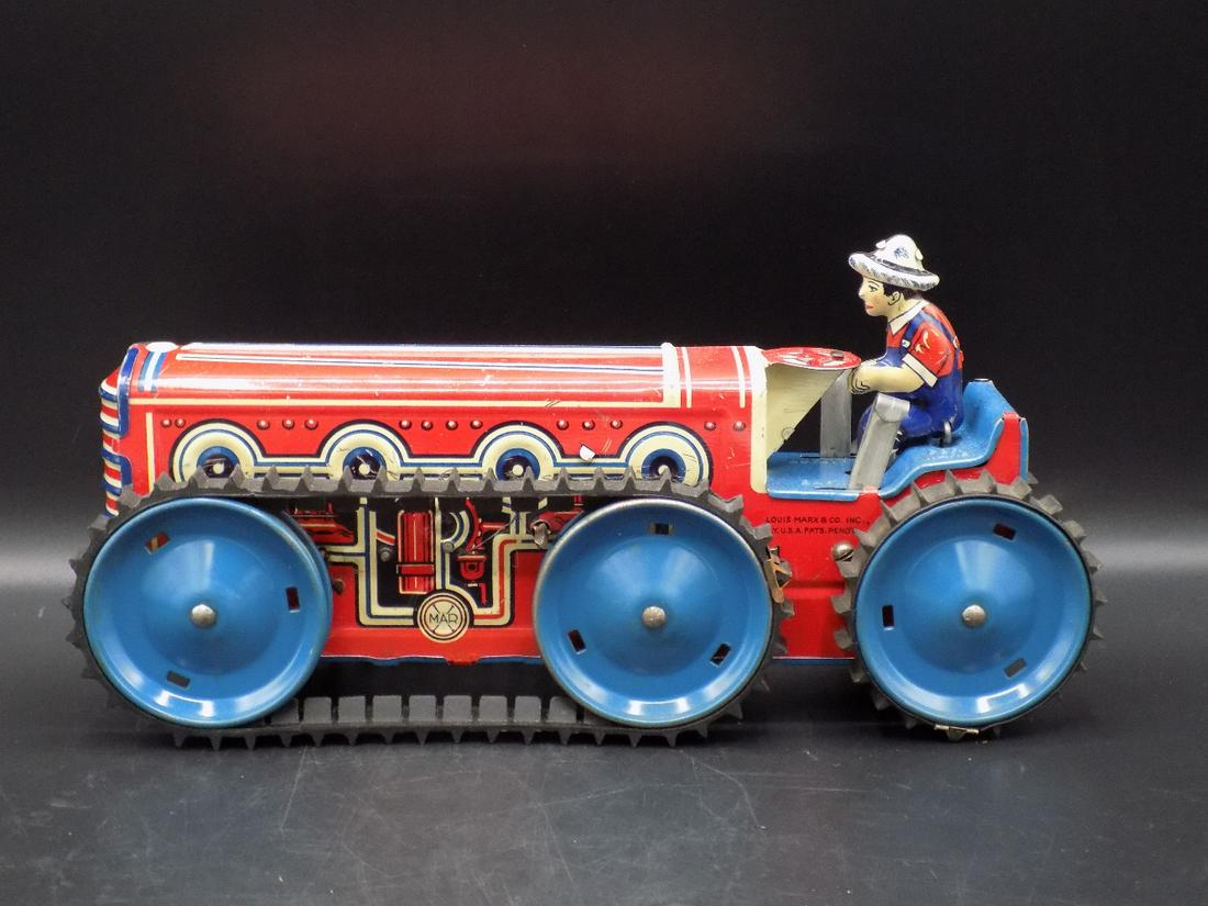 Vintage Louis Marx & CO caterpillar tin boy: Vintage Louis Marx & CO caterpillar tin boy. Marked as shown in photos. In very good original condition. Great graphics. Works. Replaced key. Please see photos to grade. Measures 5 ½” tall x 11 ½�