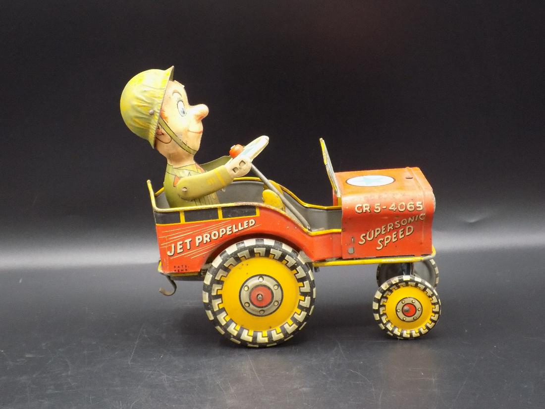 Vintage G I Joe Jouncing tin toy jeep. Unique Art Mfg.: Vintage G I Joe Jouncing tin toy jeep. Unique Art Mfg. Co. Very good original condition. Some wear normal to age as shown in photo. Please see photos to judge condition. Working. Measures 7” long x