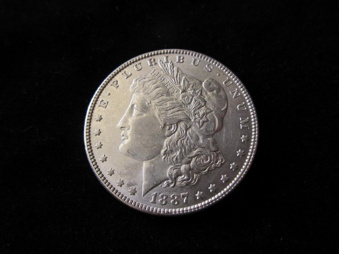 1887 uncirculated Morgan silver dollar (1 of 2)