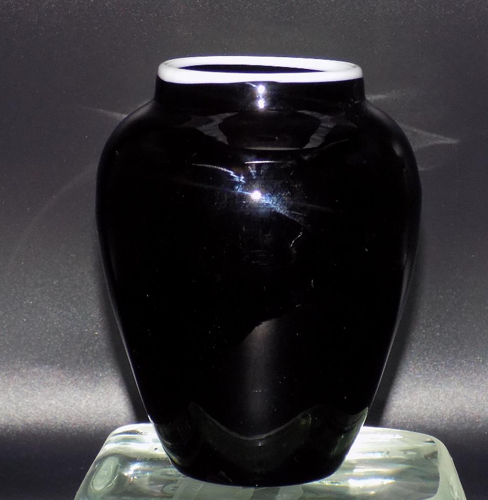 Vintage Steuben art glass black vase.: Vintage Steuben art glass black vase. Unmarked. Beautiful colors. Black with white rim. No condition problems. Measures 5 ½” tall x 2” at base
