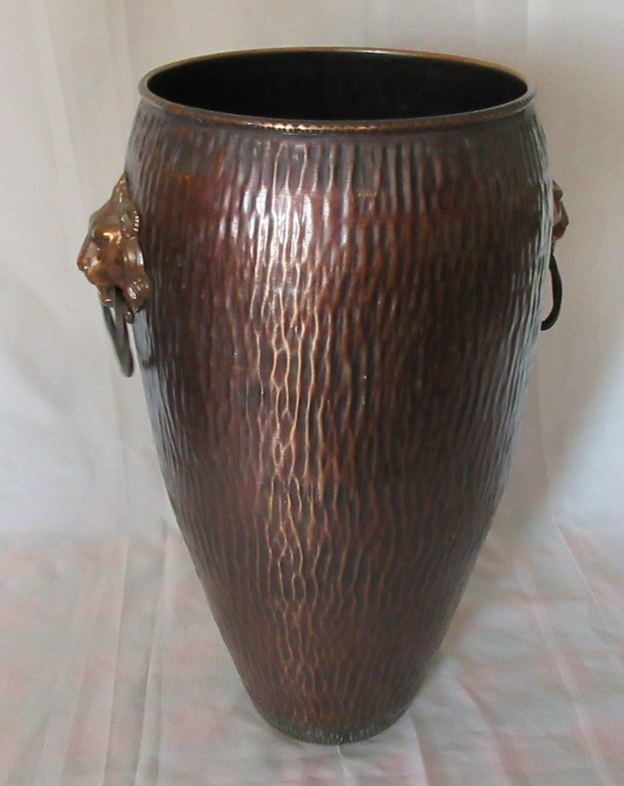 Very nice vintage copper cane or umbrella holder with: Very nice vintage copper cane or umbrella holder with lionheads. Original patina. Nice quality and detail. No maker markings. Measures 19” tall