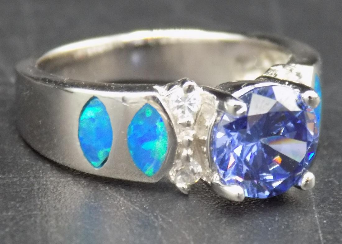 Beautiful approx. 2 ctw. tanzanite & blue opal .925: Beautiful approx. 2 ctw. tanzanite & blue opal .925 sterling silver ring. Lab created. Beautiful color & detail. Size 5