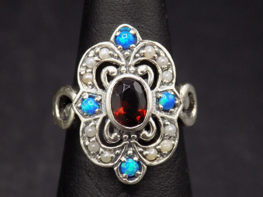 Beautiful approx. 2 cwt. fire garnet & opal .925: Beautiful approx. 2 cwt. fire garnet & opal .925 sterling silver ring. Beautiful color & detail. Size 5 3/4