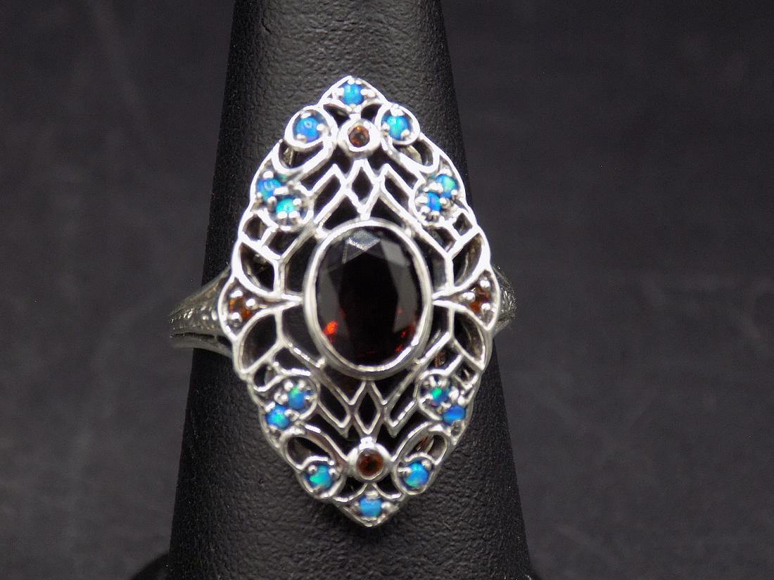 Beautiful approx. 3 cwt. fire garnet & blue opal .925: Beautiful approx. 3 cwt. fire garnet & blue opal .925 sterling silver ring. Beautiful color & detail. Size 7 1/2