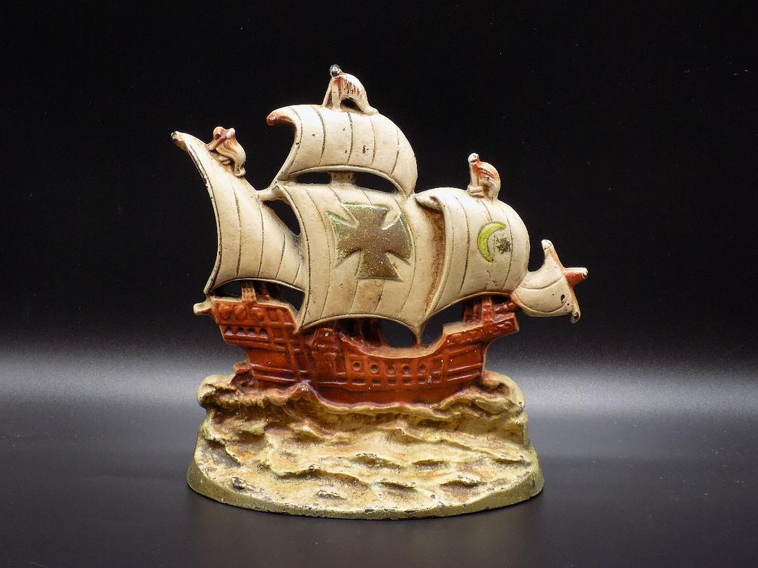 Wonderful vintage cast iron sailing ship doorstop: Wonderful vintage cast iron sailing ship doorstop. In very good original as found condition. Original paint with wear as shown in photos. Made Late 1800’s to early 1900’s. Measures 7 ½