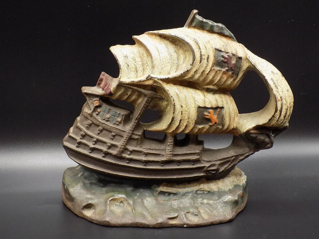 Wonderful vintage cast iron sailing ship doorstop: Wonderful vintage cast iron sailing ship doorstop. In very good original as found condition. Original paint with wear as shown in photos. Very heavy cast iron. Made Late 1800’s to early 1900R