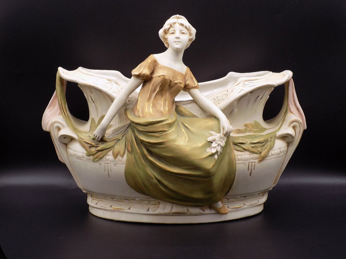 Elegant large Royal Dux figural center piece vase: Elegant large Royal Dux figural center piece vase. Beautiful colors with great quality and detail. No condition problems. Measure 11 tall and 15 inches wide. Signed on bottom as shown in photo.