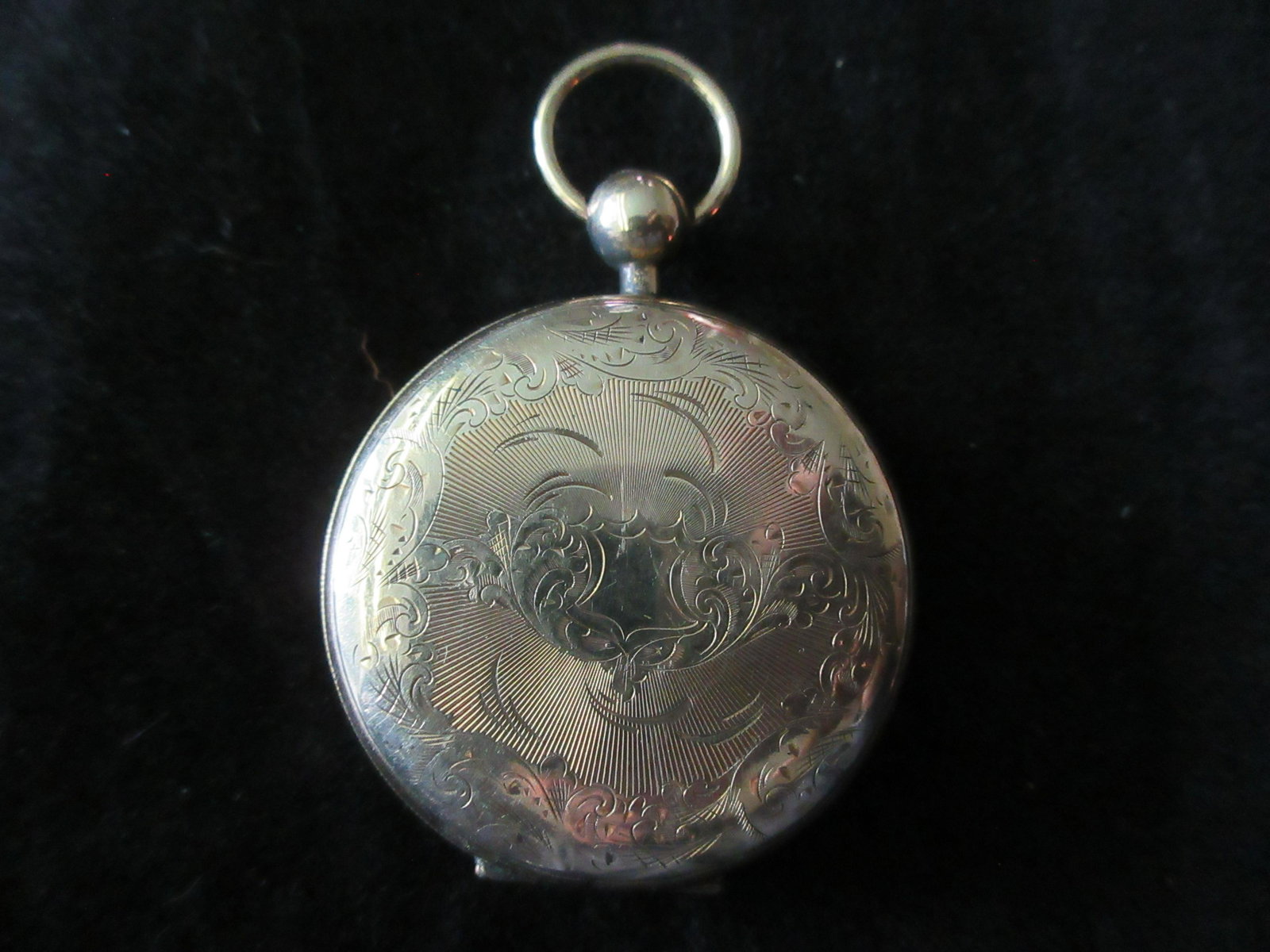 Victorian engraved gold-filled photograph locket: Victorian engraved gold-filled photograph locket. Has one original photo. Fancy engraved case on two sides as shown in photos. Great quality & detail. 1 5/8 inches, not including stem