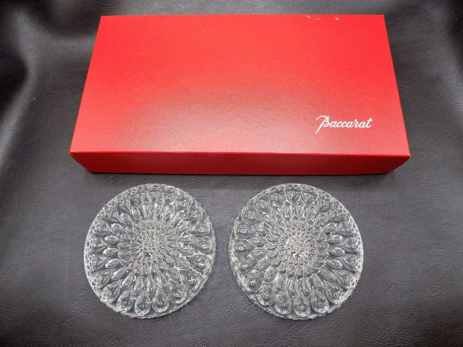 Pair signed Baccarat Goutte D eau wine bottle coasters in original box.: Pair signed Baccarat Goutte Dâ€™eau wine bottle coasters in original box. Great quality & detail. Marked on bottom as shown in photo. In very good original as found condition. (Box lid has loose