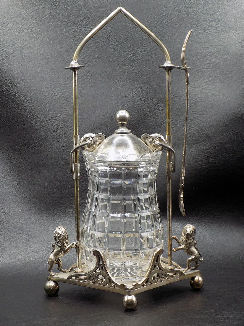 Superb Victorian Pickle Castor with Lions.: Superb Victorian Pickle Castor with Lions. Silverplate holder with lions. Marked Meriden. Lids slides up & down. Has a fork. Great quality & detail. 12 ½ inches tall