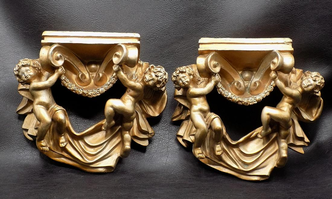 Charming pair of ornate cupid wall sconces: Charming pair of ornate cupid wall sconces. Composition not wood. In very good as found condition with Great quality & detail. Measures 6 ½ inches tall and 8 ¼ wide and 3 ½ inches