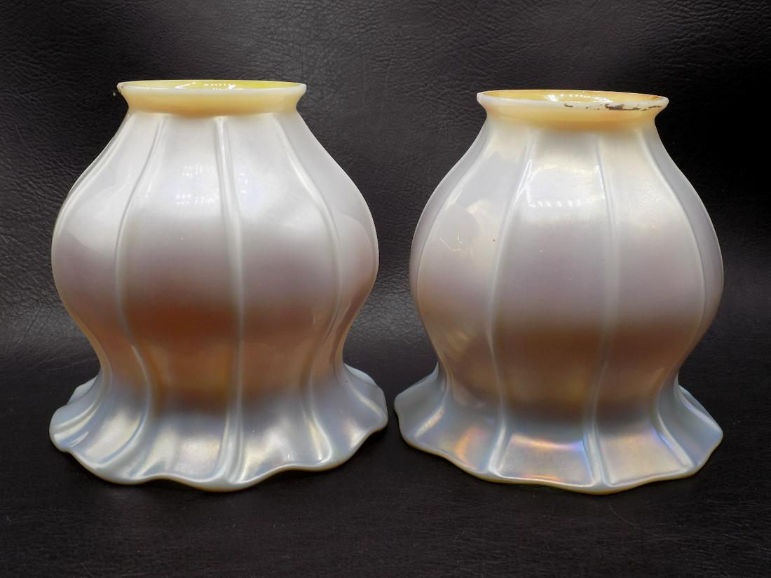 Pair of vintage Steuben art glass lamp shades: Pair of vintage Steuben art glass lamp shades. 1 shade is signed. In very good as found condition with minute fleabite on fitter rim as shown in photo. Beautiful colors. Great quality and detail. Meas