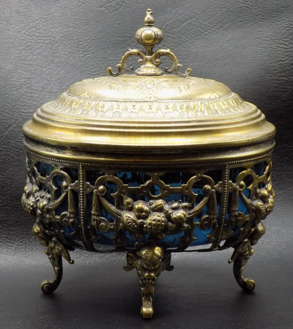 Fancy vintage Covered art glass jewelry box with cupids: ancy vintage Covered art glass jewelry box with cupids. In very good as found condition. Beautiful colors. Great quality and detail. Measures 8 ¼ inches tall and 6 ¼ wide