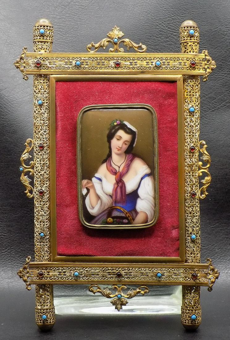 Magnificent Antique Hand painted Porcelain and Ornate Frame: Magnificent Antique Hand painted Porcelain and Ornate Frame. Beautiful hand painted portrait of lady. Stones inset in frame. Great quality and detail. Porcelain 3 ¾ inches tall x 2 ½ wide. F