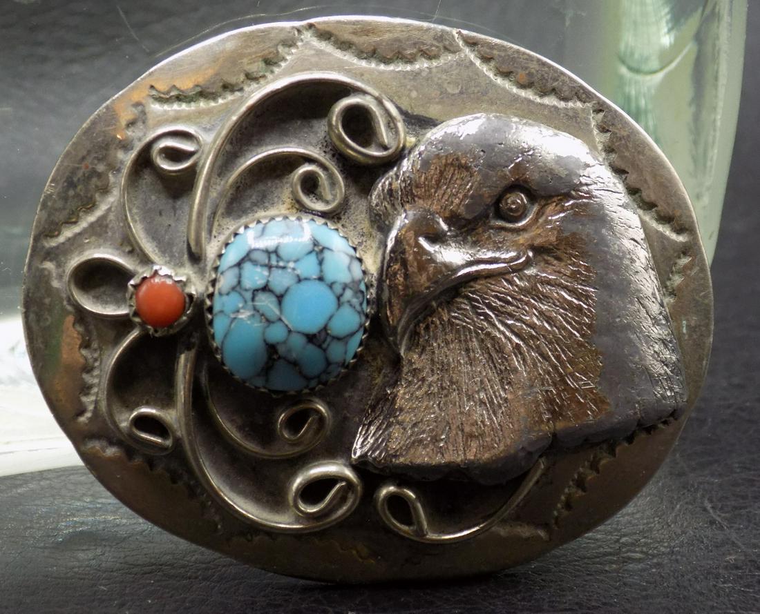 Vintage Native American Indian Belt Buckle: Vintage Native American Indian Belt Buckle. Sterling (unmarked but guaranteed) with Eagle. Turquoise, and coral. Great quality and detail. In very good original as found condition. 2 ½ inches wid