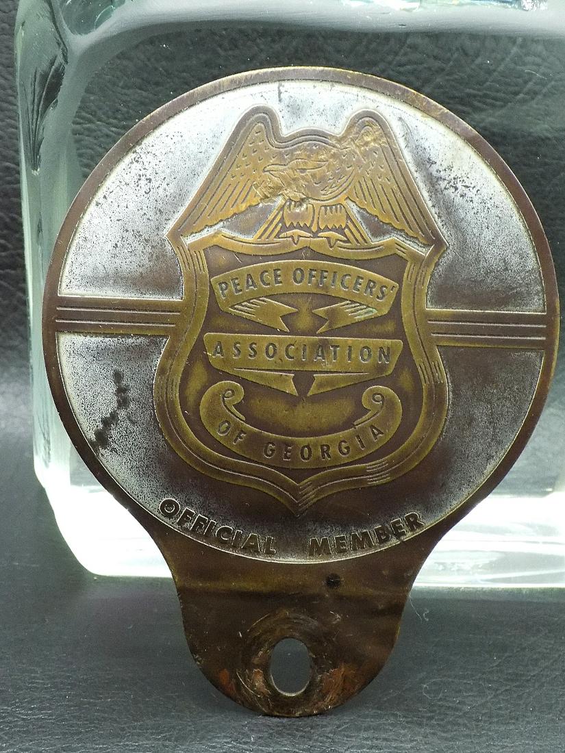 Vintage Georgia Peace Officers License Plate Topper: Vintage Georgia Peace Officers License Plate Topper. !930-1950. In very good original as found condition. Great quality and detail. 4 ½ inches tall x 3 ½ wide