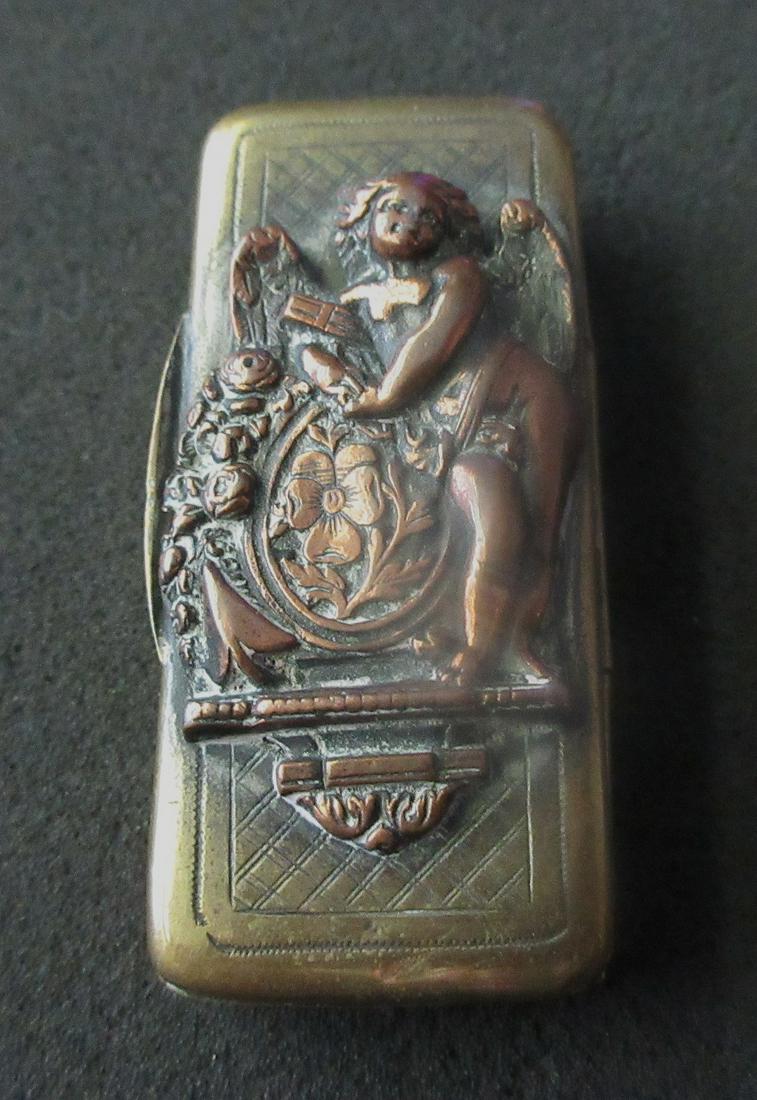 Wonderful antique figural match safe: Wonderful antique figural match safe. With angel in three dimensional relief. In very good original as found condition. Great quality and detail. 3 3/8 long x 1 inch wide
