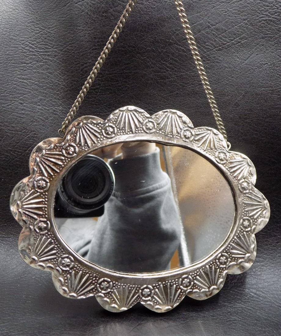Fancy vintage .900 silver hanging mirror: Fancy vintage .900 silver hanging mirror. Also marked BEDO as shown in photo. Great quality and detail. In very good original as found condition. 5 ½ wide x 4 ¼ tall, not including chain