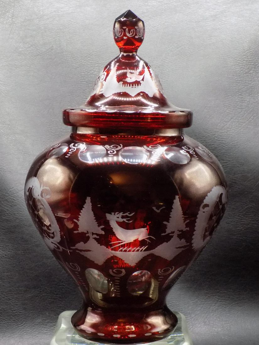 Vintage cranberry cut to clear art glass covered jar: Vintage cranberry cut to clear art glass covered jar. With scenes of deer, bird, and house. Probably Egermann. Great quality and detail. In very good original as found condition. 10 ¾ tall x 6 &#