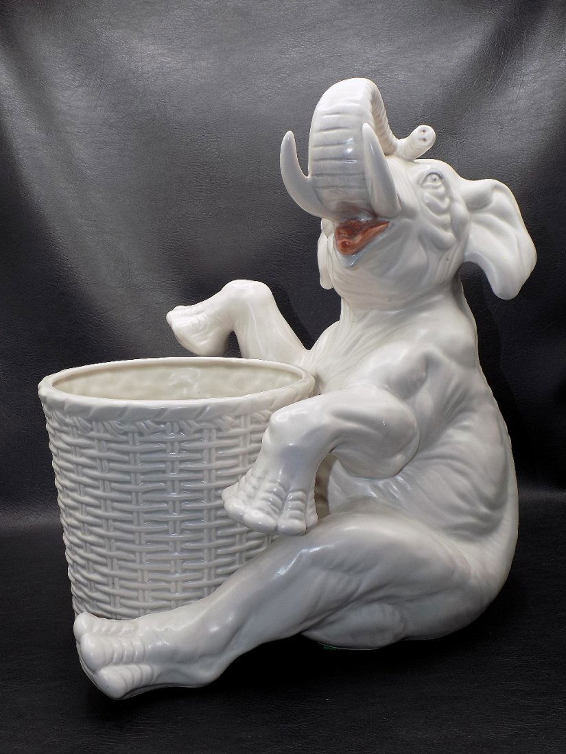 Unusual vintage porcelain elephant with basket: Unusual vintage porcelain elephant with basket. Great quality and detail. Marked on bottom F F Japan on bottom as shown in photo. F. and F. is Fitz and Floyd 12 inches tall Basket 6 inches wide. 11 &f