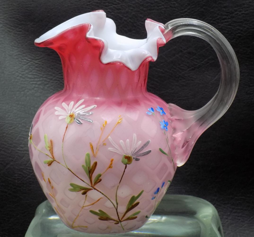 Exceptional antique Mt. Washington diamond quilted satin glass art glass cream pitcher: Exceptional antique Mt. Washington diamond quilted satin glass art glass cream pitcher. Hand painted flowers. Beautiful colors. Great quality and detail. Hand blown. 5 inches tall