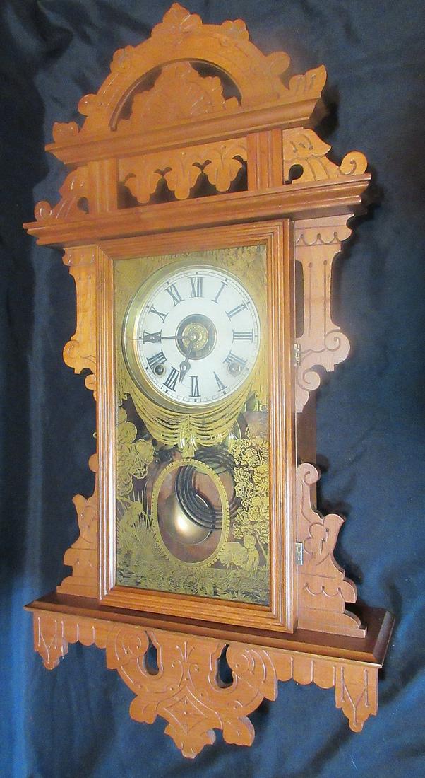 Ornate Antique Welch hanging kitchen clock with paperweight pendulum: Ornate Antique Welch hanging kitchen clock with paperweight pendulum. Original highly decorated glass. In very good original as found condition. Working at time of listing. 27 ½ x 14 inches wide