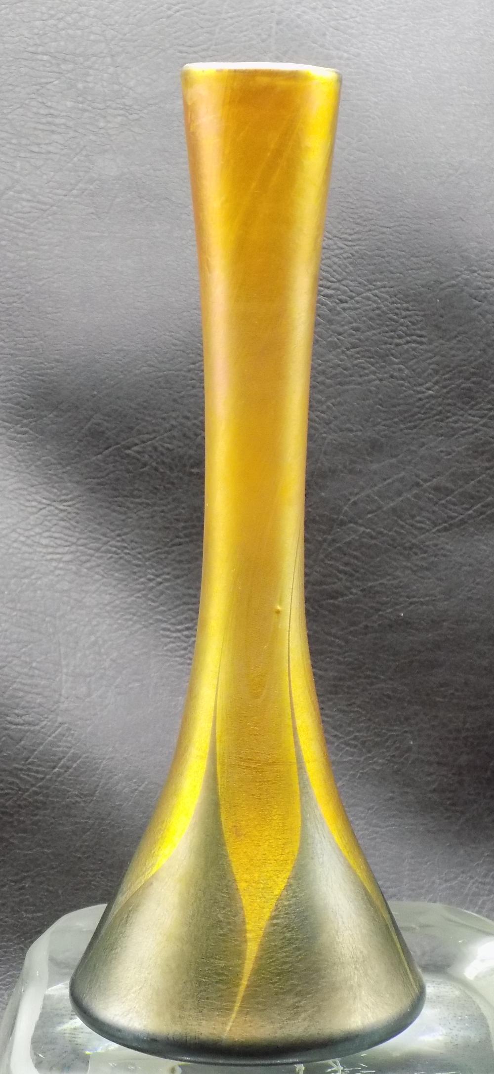 Beautiful antique signed L C Tiffany Favrile feather pulled art glass vase. Great iridescent colors: Beautiful antique signed L C Tiffany Favrile feather pulled art glass vase. Great iridescent colors and detail. In very good original as found condition. Signed on bottom as shown in photos. 7 ¾