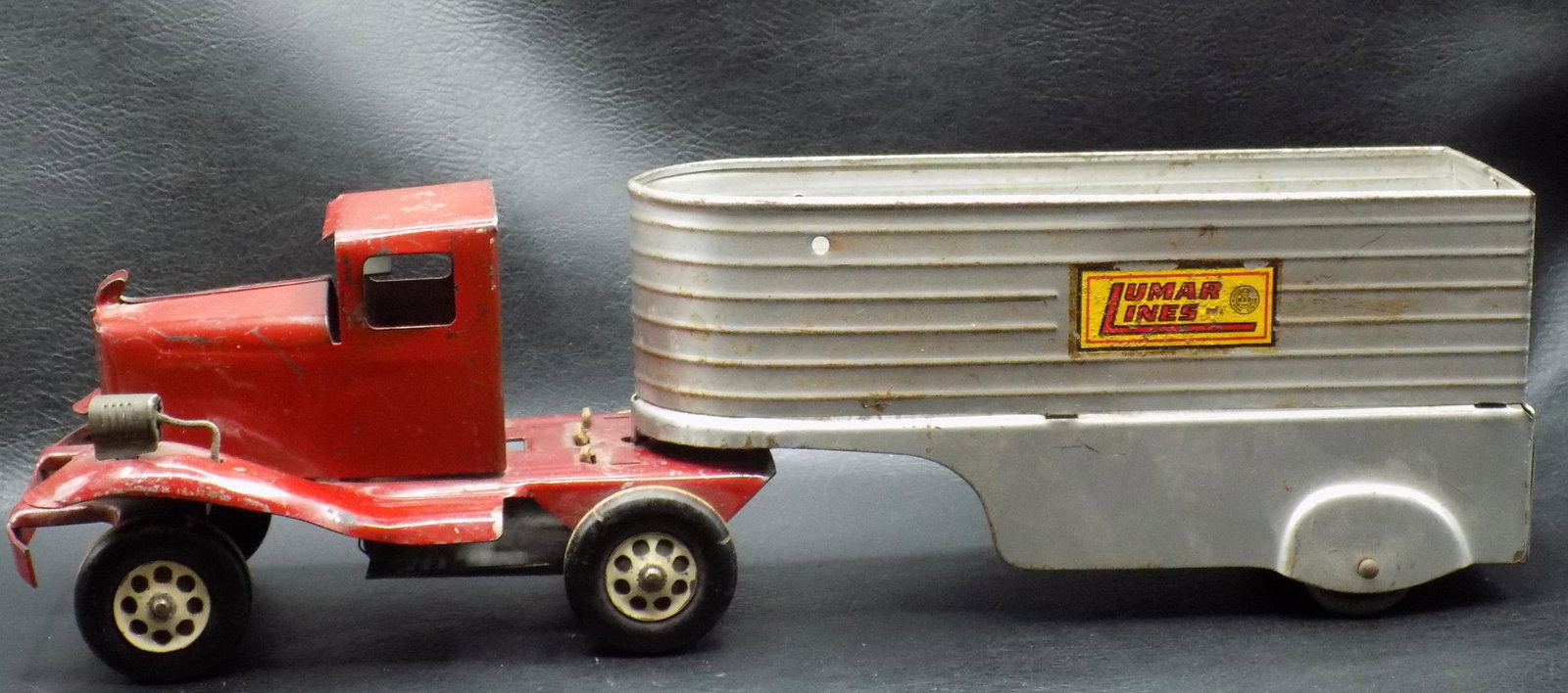 Vintage Marx truck and trailer. Lumar Lines: Vintage Marx truck and trailer. Lumar Lines. In good condition with wear normal from age and use as shown in photos. 13 ¼ long x 4 ¼ tall
