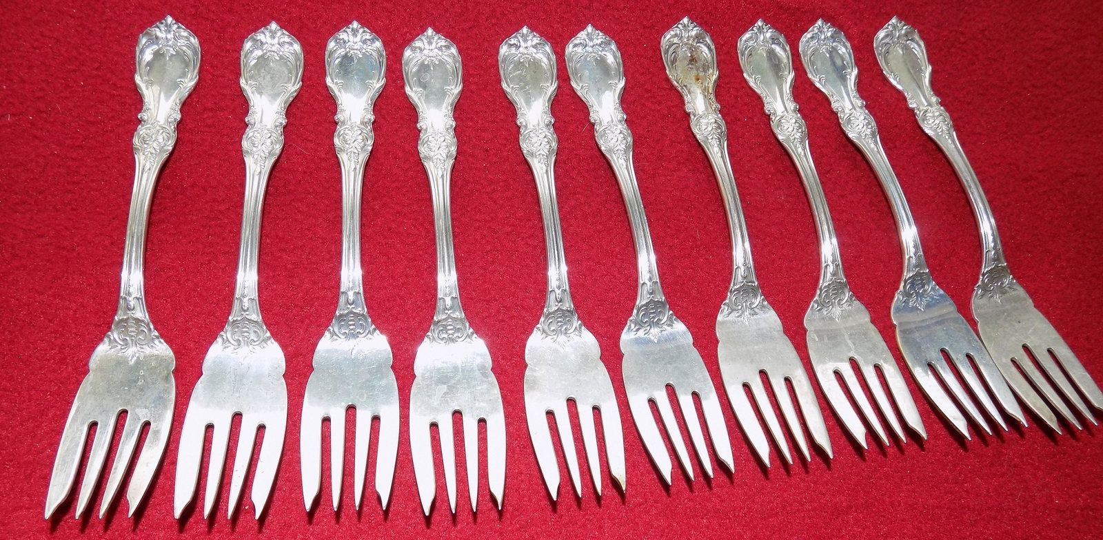 Ten vintage Reed and Barton Burgundy sterling silver salad forks: Ten vintage Reed and Barton Burgundy sterling silver salad forks. No monogram. Great quality and detail. In very good original as found condition. Marked sterling as shown in photo. 6 ½ inches lo