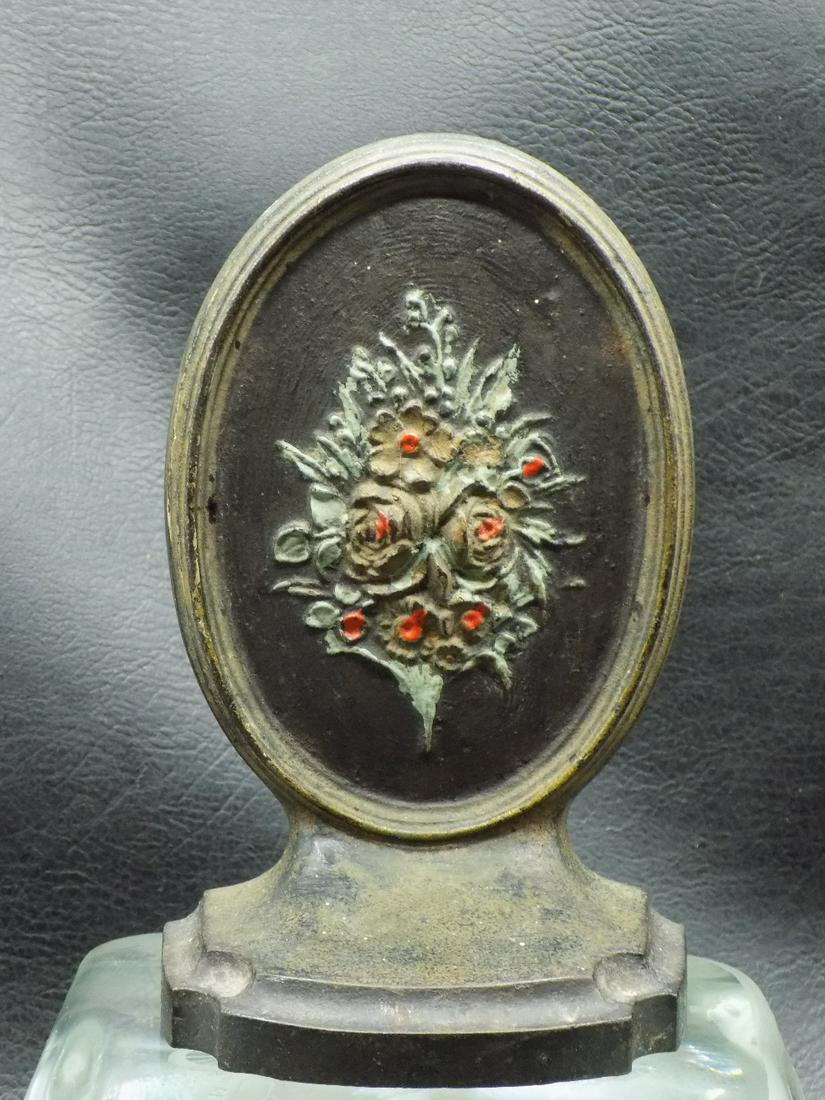 Antique cast iron doorstop. Marked B and H as shown in photo: Antique cast iron doorstop. Marked B and H as shown in photo. Hand painted floral decoration. In very good original as found condition. 5 ¾ tall x 3 ½ wide at base