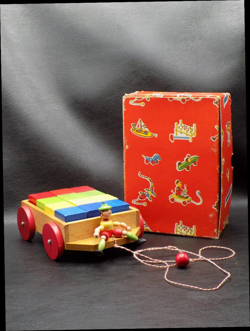 Vintage Austrian toy in original box: Vintage Austrian toy in original box. Pull toy wagon with wood blocks. Like new condition. Beautiful colors. 7 inches long x 5 inches wide