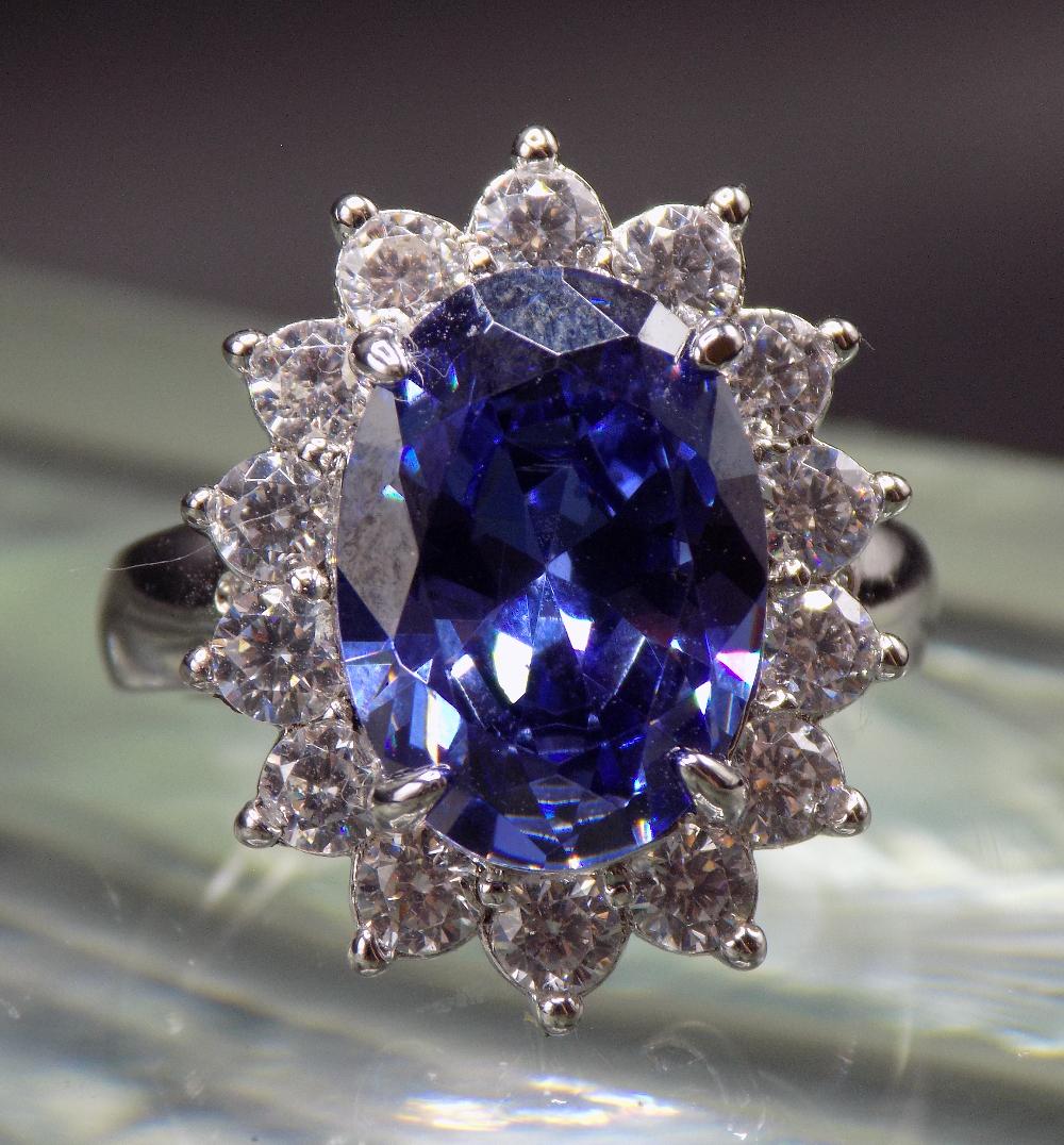 Beautiful 7 cwt. blue tanzanite and white topaz  sterling silver ring. (1 of 5)