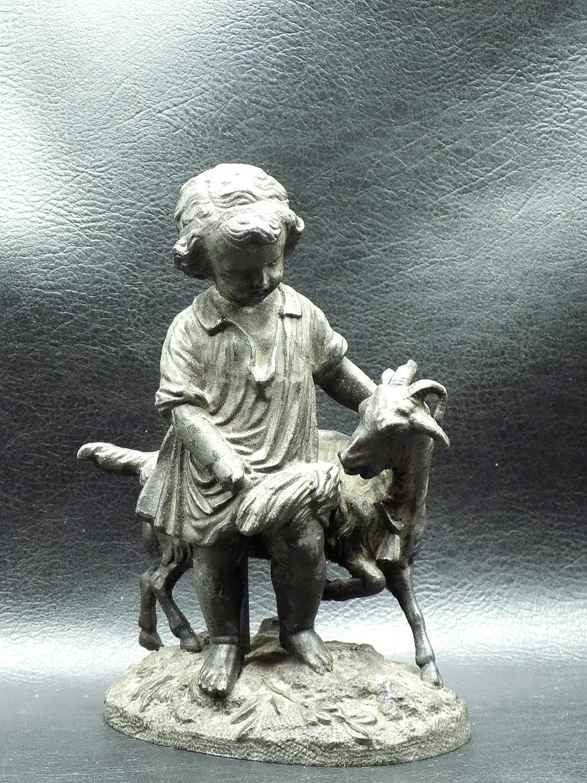 Charming antique statue of child with goat.: Charming antique statue of child with goat. It looks bronze and is heavy. Fabulous quality and detail. Did not find a signature. In very good original as found condition. 6 inches tall. Base 4 1/8 x 2