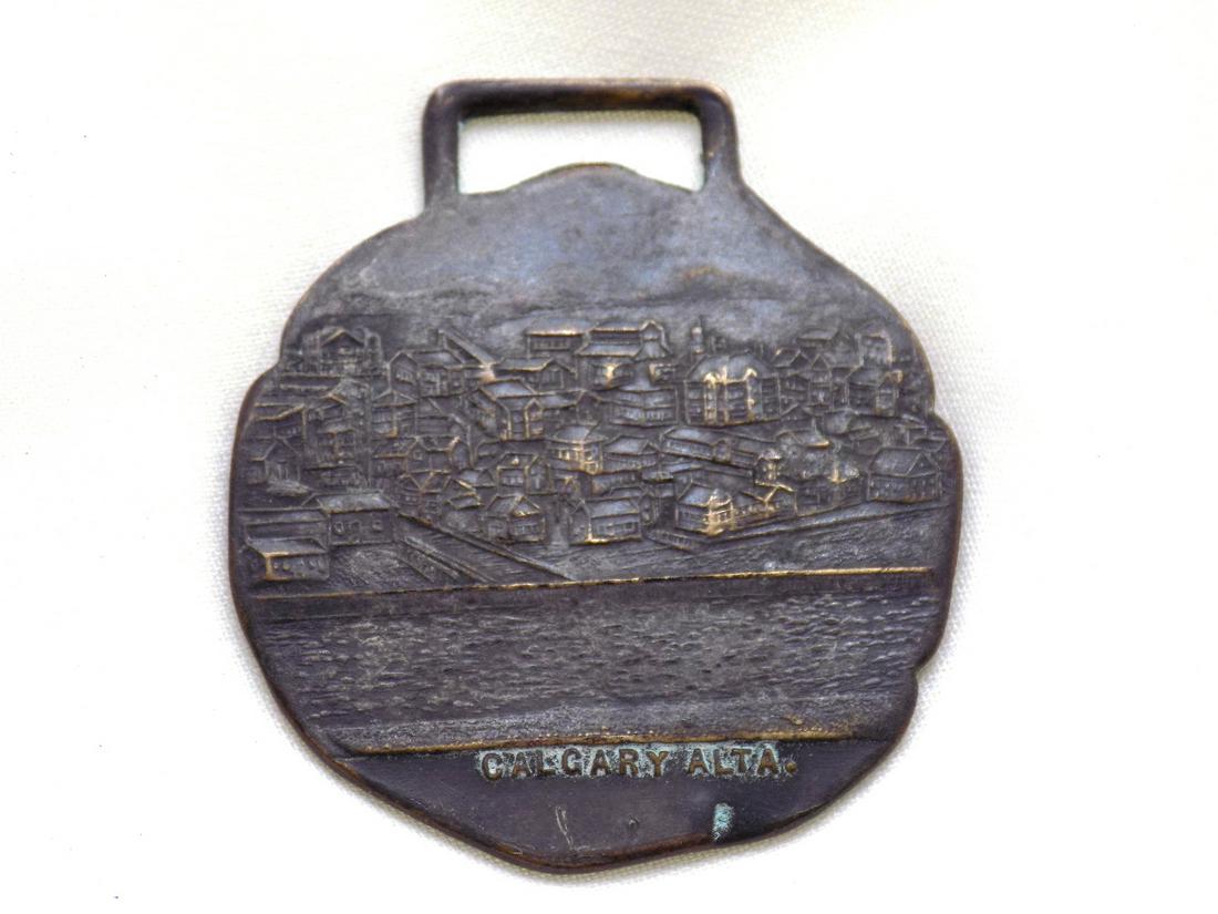 Antique Calgary Alta watch fob. Three dimensional relief of Calgary (1 of 4)